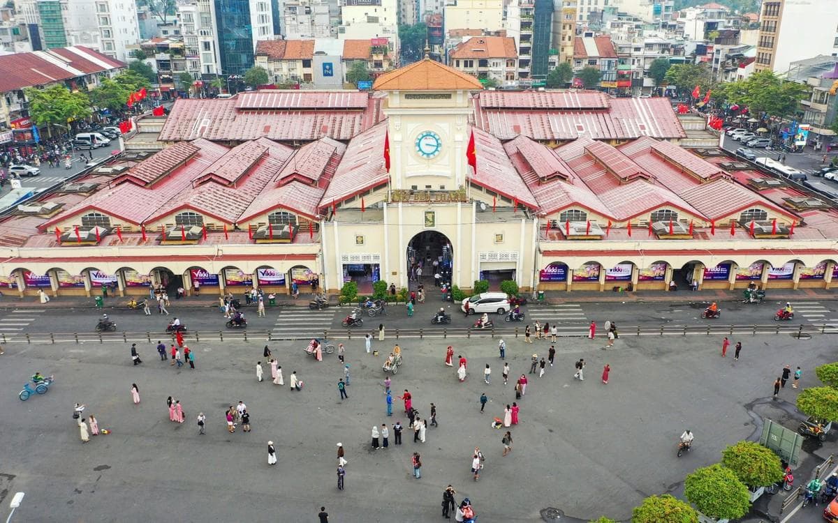 A busy Vietnamese city street with motorbikes and traffic